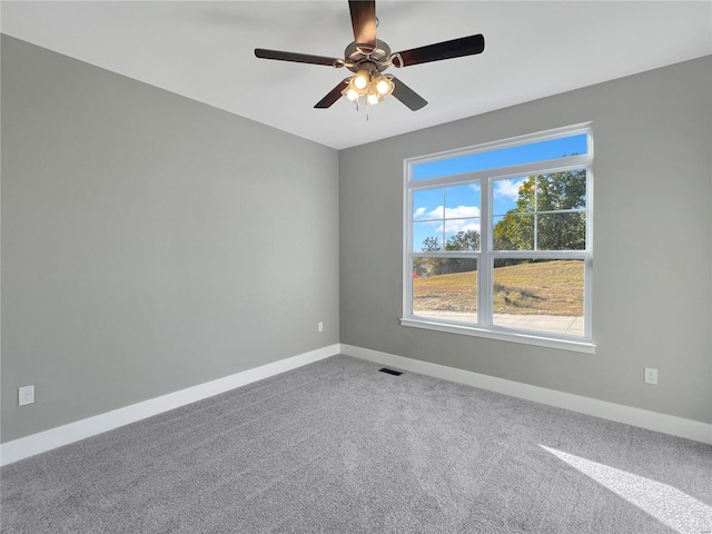 unfurnished room featuring carpet flooring and ceiling fan