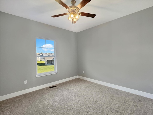 carpeted empty room with ceiling fan