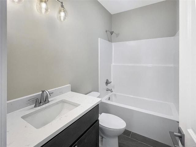 full bathroom featuring vanity, toilet, washtub / shower combination, and tile patterned flooring