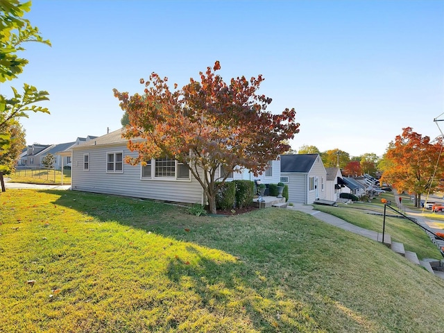 exterior space with an outbuilding and a yard