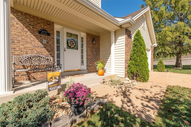 doorway to property featuring covered porch