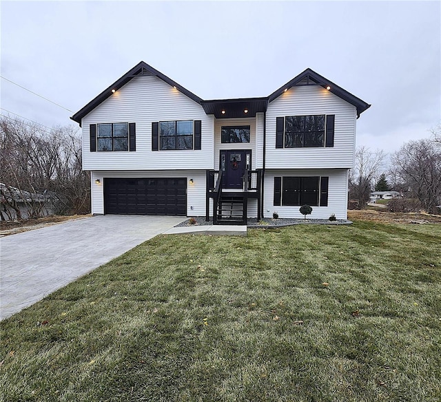 bi-level home featuring a front yard and a garage