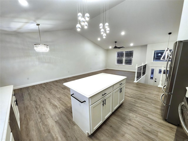 kitchen featuring white cabinetry, pendant lighting, and a center island