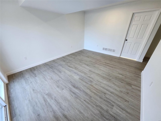 empty room featuring hardwood / wood-style flooring