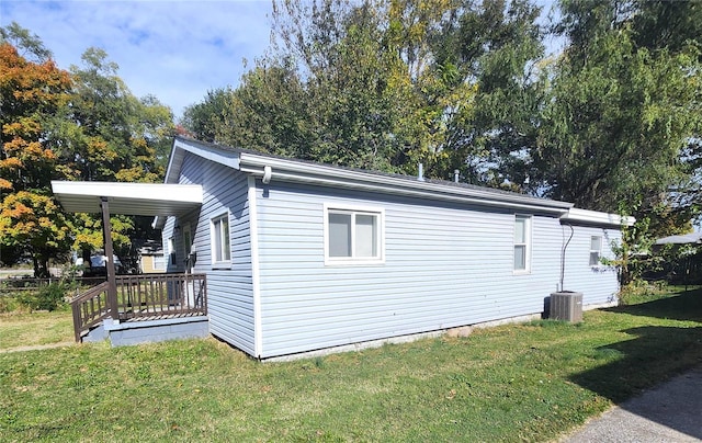 view of home's exterior featuring a deck and a lawn