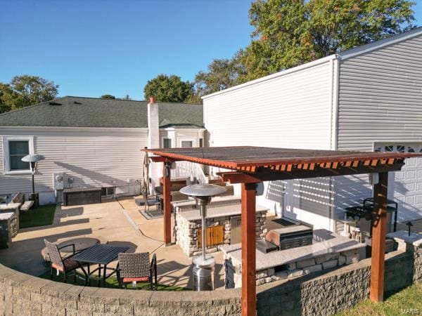 view of patio / terrace with exterior kitchen and exterior bar