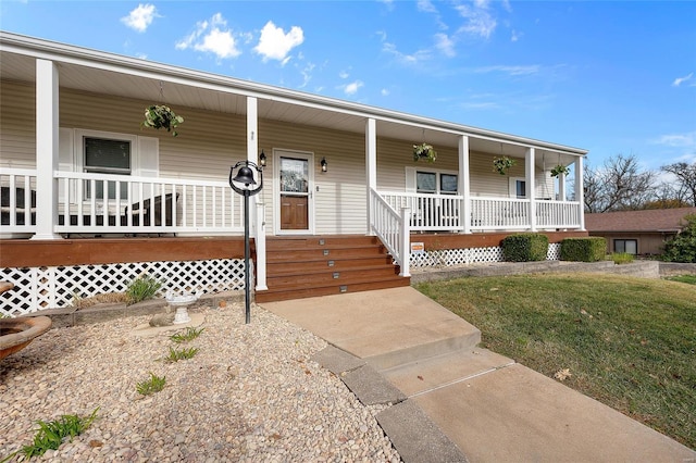 view of front of home with a porch and a front yard