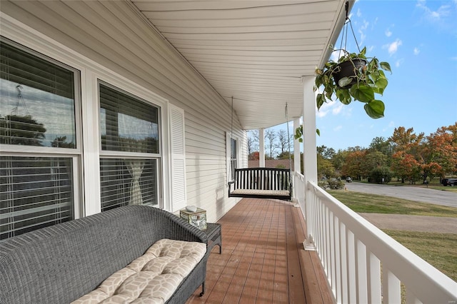 balcony featuring covered porch