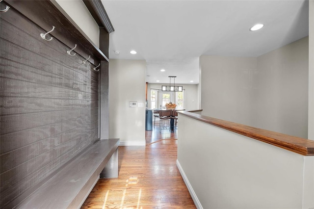 mudroom with light hardwood / wood-style floors