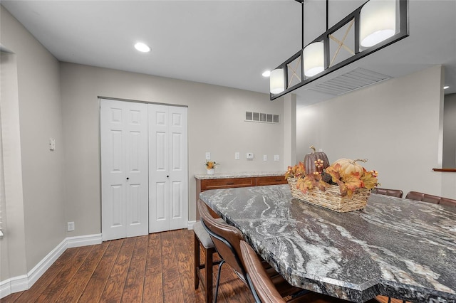 dining area featuring dark hardwood / wood-style flooring