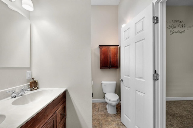 bathroom with toilet and vanity