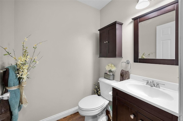 bathroom with toilet and vanity