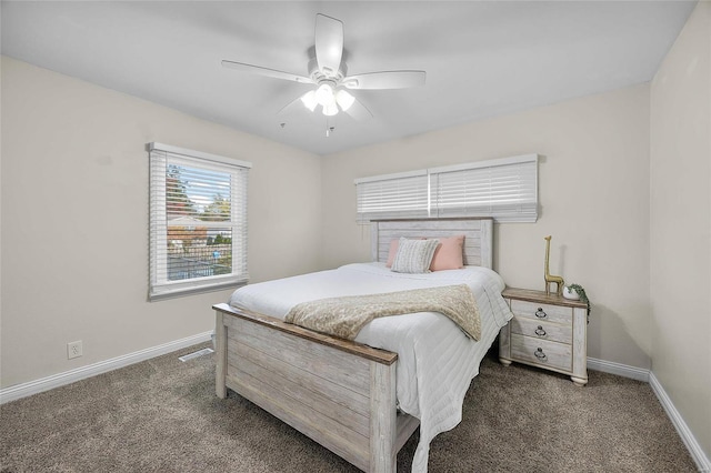 bedroom featuring ceiling fan and dark colored carpet