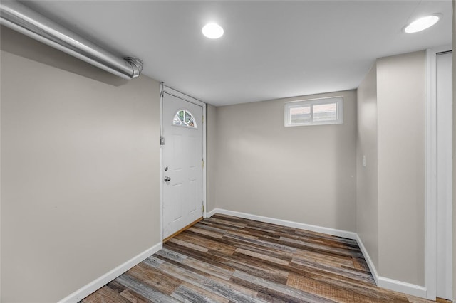 basement featuring dark hardwood / wood-style floors