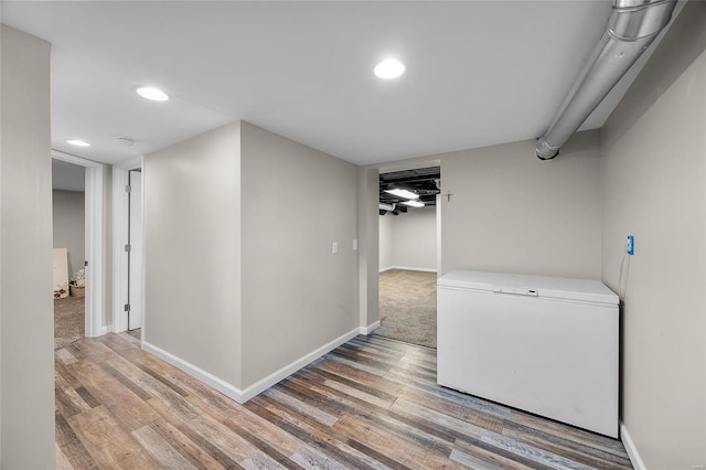 hallway featuring wood-type flooring