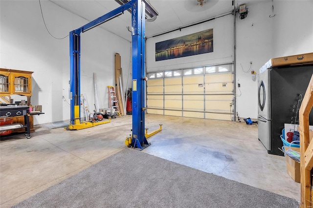 garage featuring stainless steel refrigerator