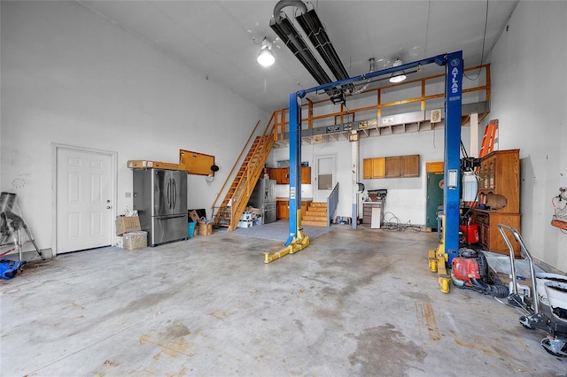 garage featuring stainless steel fridge