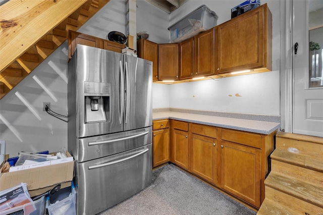 kitchen featuring stainless steel fridge with ice dispenser