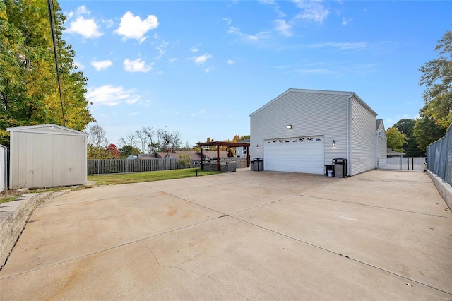 view of side of property with a garage and a shed