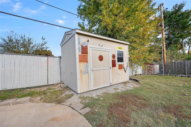 view of outbuilding featuring a lawn