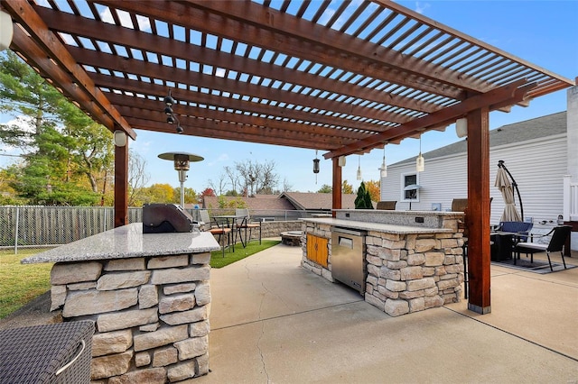 view of patio / terrace featuring a bar, area for grilling, and a pergola