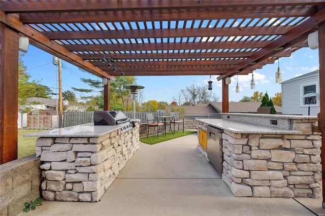 view of patio with an outdoor kitchen, a bar, a pergola, and grilling area