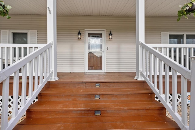 view of exterior entry featuring a porch