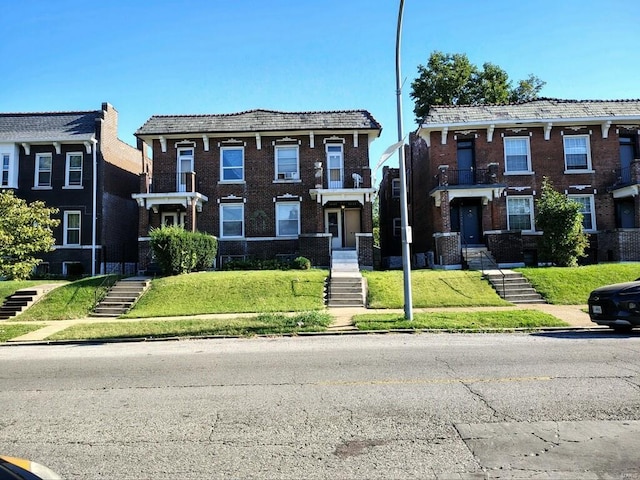 view of front facade featuring a front yard and cooling unit