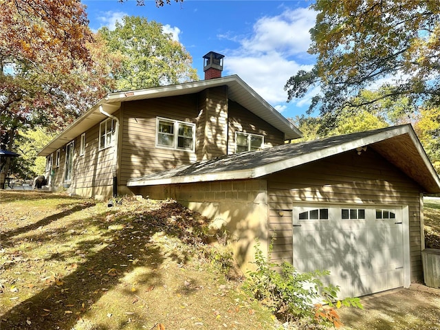 view of property exterior with a garage