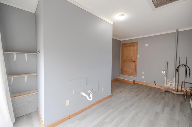 interior space with light hardwood / wood-style flooring and crown molding