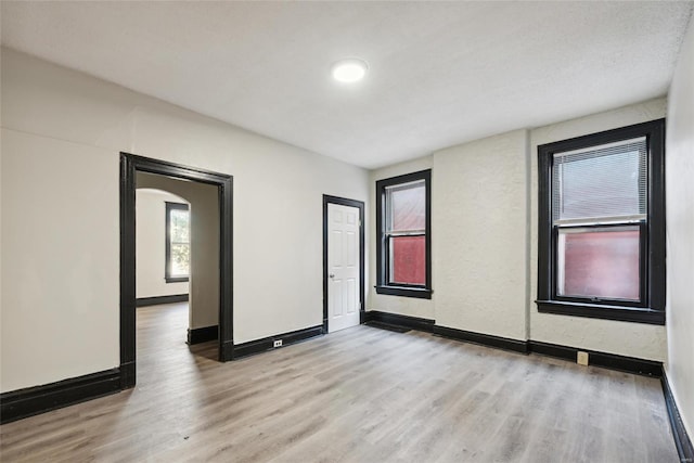 spare room featuring light hardwood / wood-style flooring