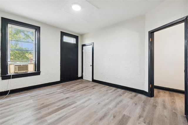 entrance foyer featuring cooling unit and light hardwood / wood-style floors