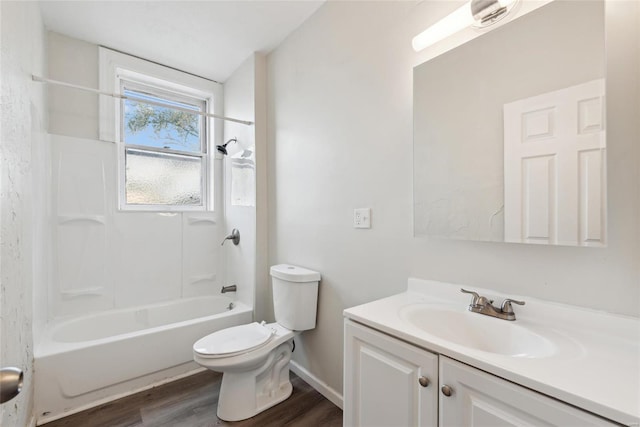 full bathroom featuring toilet, hardwood / wood-style flooring, vanity, and bathing tub / shower combination