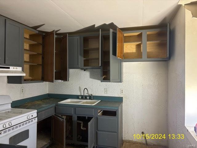 kitchen with gray cabinets, sink, and electric range