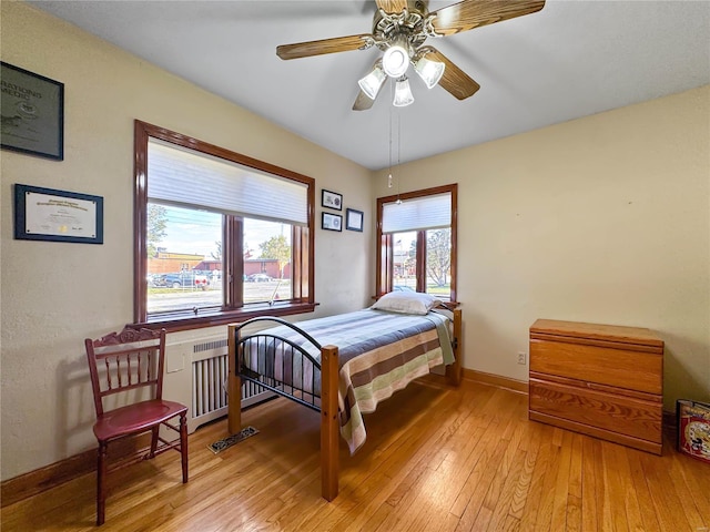 bedroom featuring light hardwood / wood-style flooring and ceiling fan