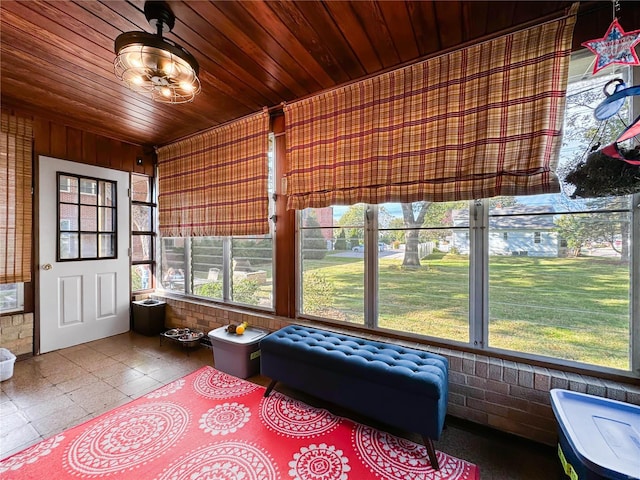 sunroom featuring wooden ceiling