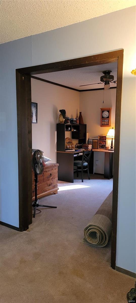 home office with carpet floors and a textured ceiling