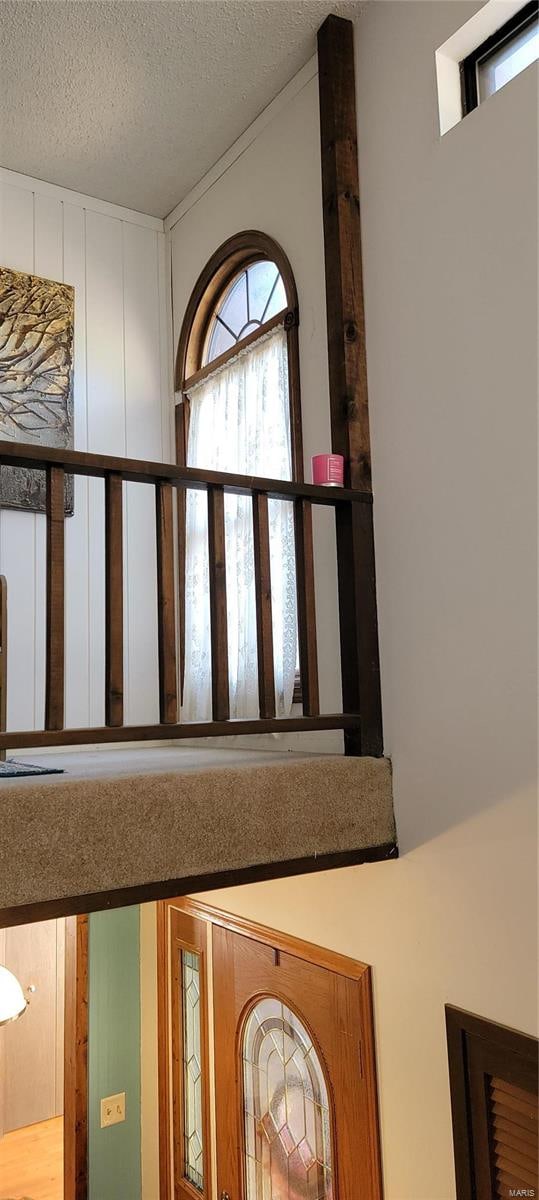 interior details featuring a textured ceiling