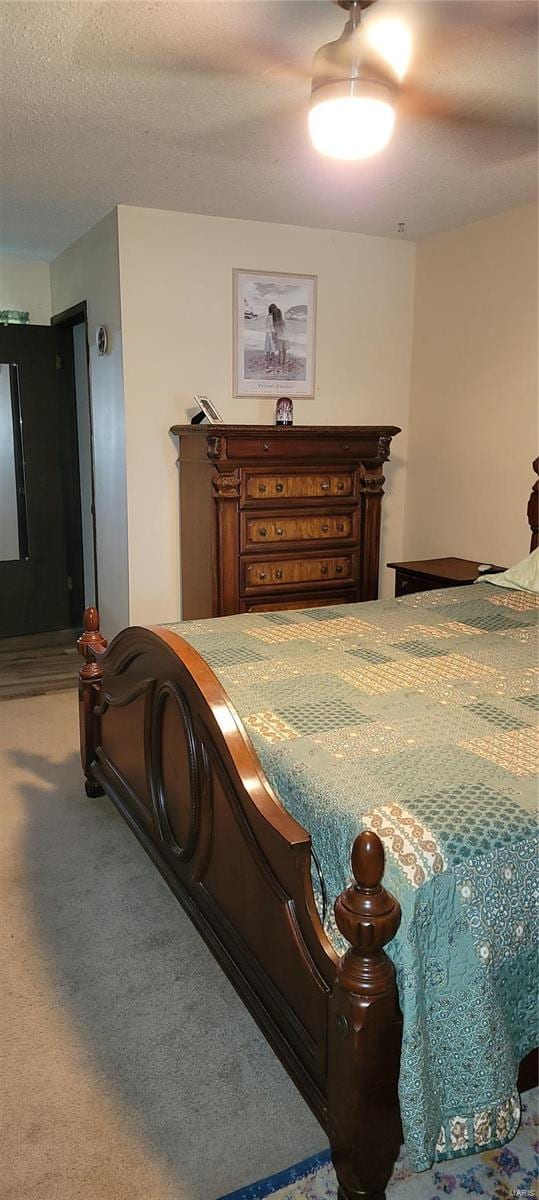 carpeted bedroom featuring a textured ceiling