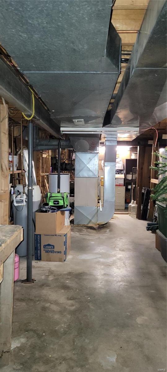 basement with heating unit and water heater