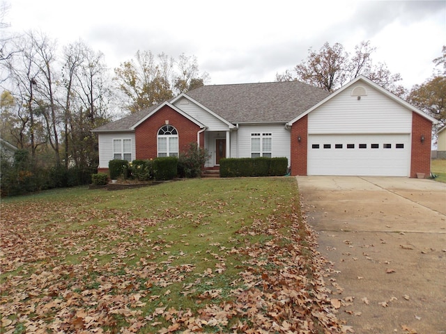 ranch-style house featuring a garage and a front yard