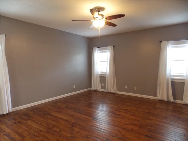 unfurnished room featuring dark hardwood / wood-style flooring and ceiling fan