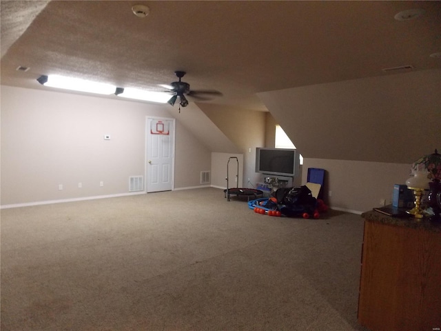 game room with carpet floors, ceiling fan, and lofted ceiling