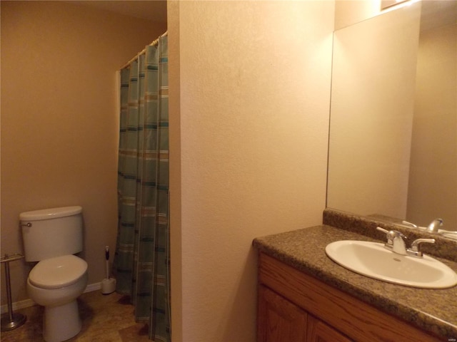 bathroom featuring vanity, tile patterned floors, toilet, and a shower with shower curtain