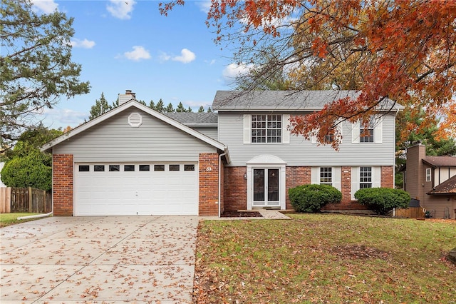 view of front facade with a garage and a front lawn