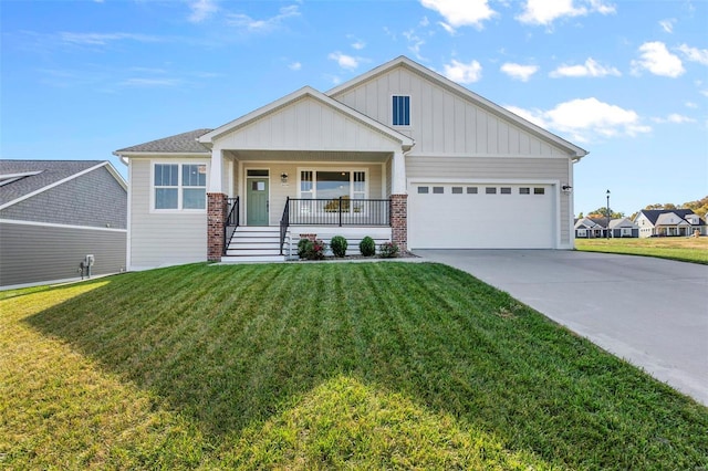 craftsman-style home with covered porch, a front yard, and a garage