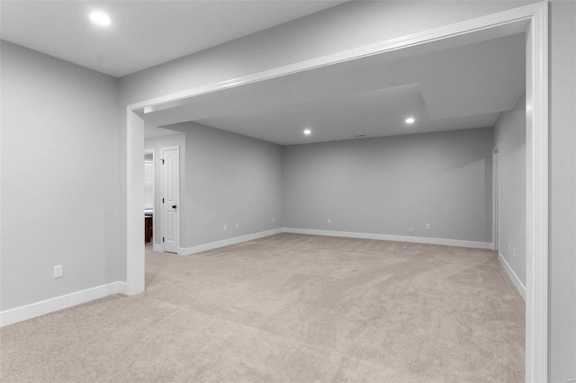 unfurnished room with light colored carpet