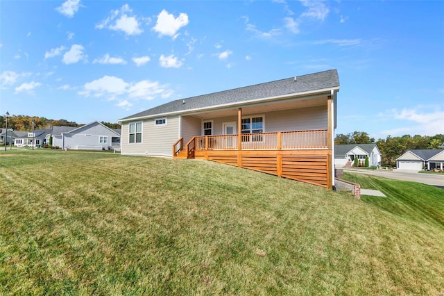 rear view of house with a yard