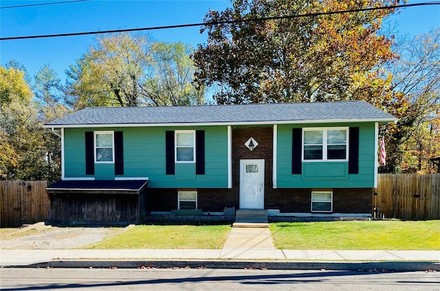 bi-level home with a front yard