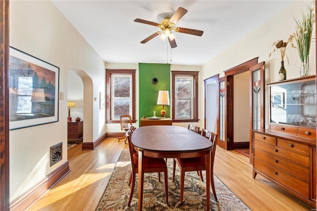 dining room with light wood-type flooring and ceiling fan